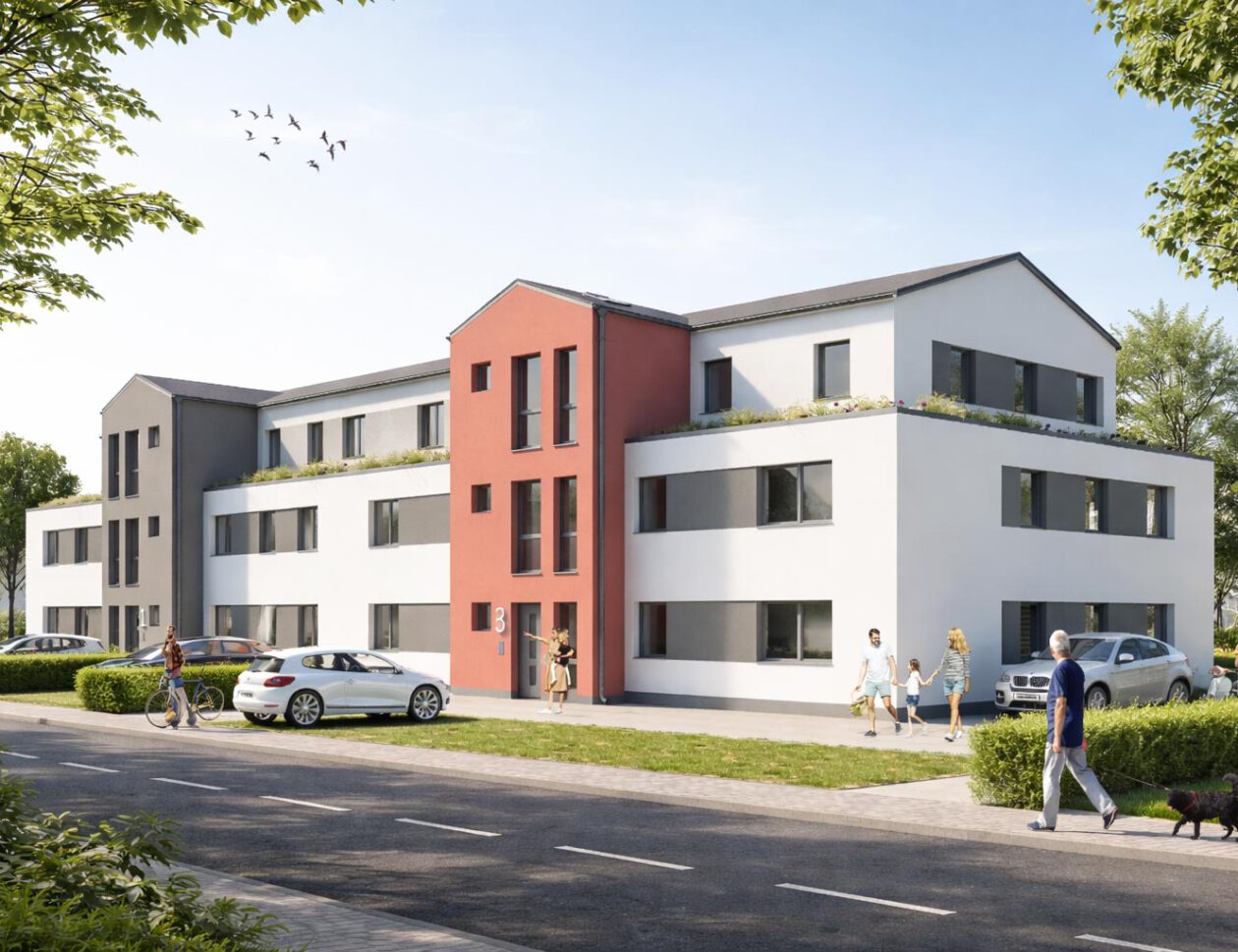 Eingangsbereich des Neubauprojekts Grüner Weg in Lindhorst mit roter Fassadenakzentwand, Dachbegrünung und Außenanlagen