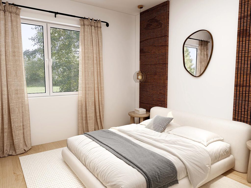 Helles Schlafzimmer einer Mietwohnung am Zum Rehmer Eck in Bad Oeynhausen – Doppelbett, großflächige 3-fach-verglaste Fenster mit Blick ins Grüne.